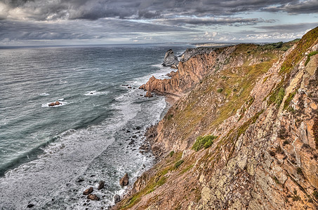 海边岩悬崖葡萄牙地标海岸旅游爬坡旅行场景全景力量海滩日出图片