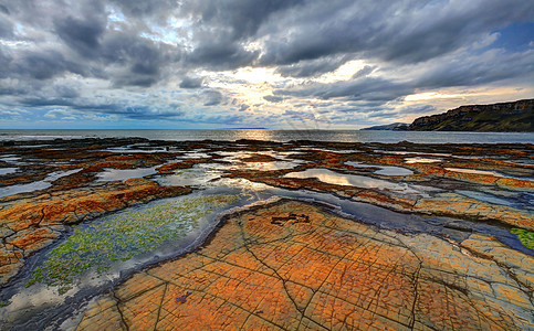 金梅里奇湾蓝色波浪旅行海浪日落岩石海洋旅游海滩风景图片