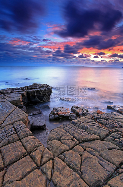 金梅里奇湾天空波浪海岸线风景海滩岩石日落海浪旅行蓝色图片