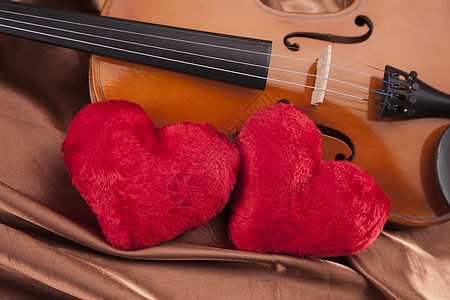 美丽的玫瑰和小提琴中提琴黑色细绳床单旋律笔记木头音乐棕色艺术图片