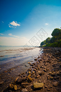 海滩海岸线太阳日落紫色墙纸石头晴天海岸海洋场景图片