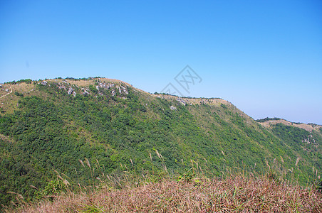 看着中国的钉钉山脊衬套悬崖顶峰远景岩石亮度山顶山腰吸管天空图片