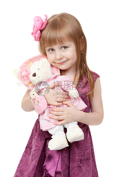 4岁小女孩的肖像画 一个四岁的小姑娘 带一个胖玩具图片