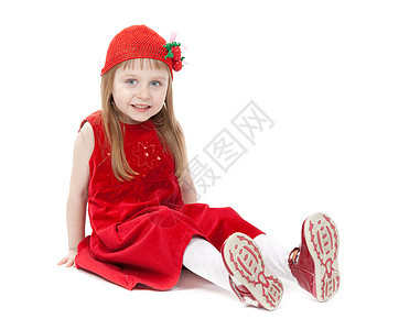 坐在地板上 一个四岁的女孩穿着红裙子坐在地板上图片