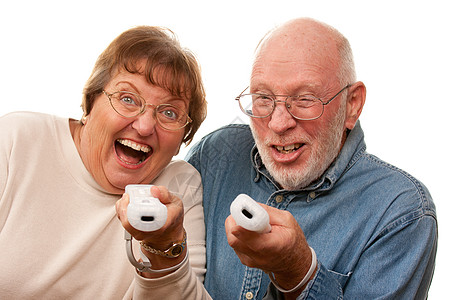快乐的老夫妇与远程玩视频游戏技术祖母夫妻奶奶游戏机竞赛电脑老年乐趣男人图片