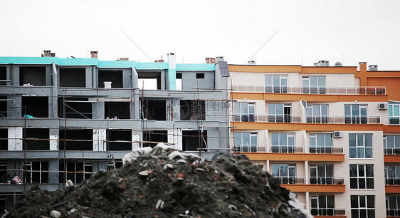 建筑工地海拔男性金属建筑物组装蓝色工人生长公寓工作图片