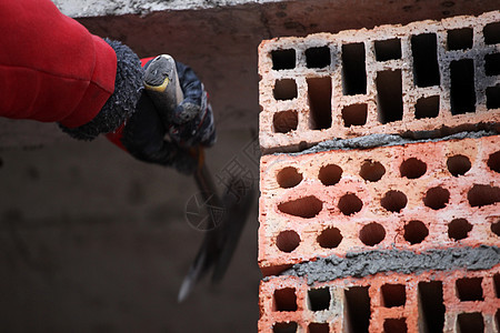 建筑工砖工人砖匠劳动者砂浆男人石头工匠建造工作房子石工技术图片