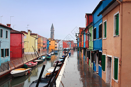意大利 威尼斯 布拉诺岛蓝色雨量游客建筑房屋粉色旅行旅游黄色房子图片