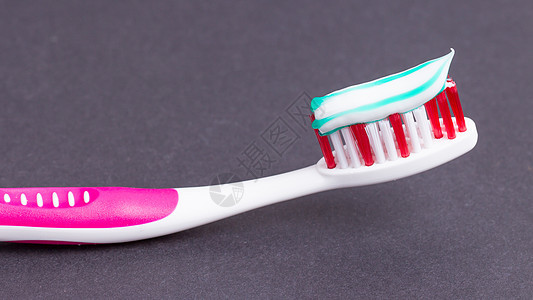 带牙膏的粉红色牙刷牙科保健卫生塑料药品凝胶牙医洗手间微笑宏观图片