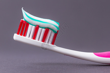带牙膏的粉红色牙刷塑料牙科微笑凝胶宏观药品卫生牙医保健洗手间图片