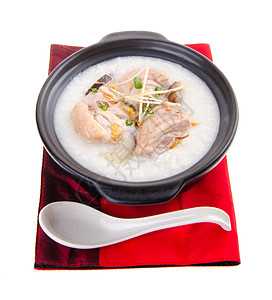 泥锅里用过传统的中国粥粥水稻汁文化猪肉蔬菜餐厅食物水平午餐早餐稀饭图片