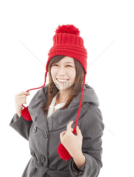 身着冬衣和帽子的年青年轻妇女图片
