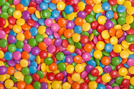 多彩的糖果薄荷糖药片圆圈聪明人乐园派对巧克力药品背景图片