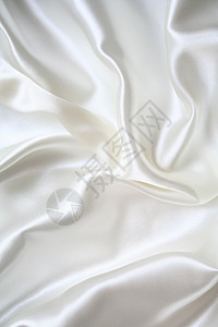平滑优雅的白色丝绸作为背景布料感性投标婚礼反光新娘银色海浪涟漪纺织品图片