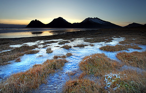 冰岛冷冻海岸海滩日落火山假期旅行海岸线蓝色海洋天空风景图片