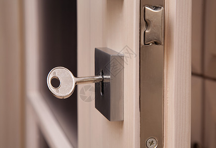 键洞中的密钥宏观木头锁孔入口金属隐私财产闩锁钥匙图片