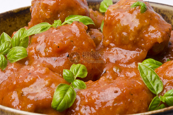 番茄酱中的肉丸子牛肉盘子情调烧烤西红柿猪肉午餐饮食宏观派对图片