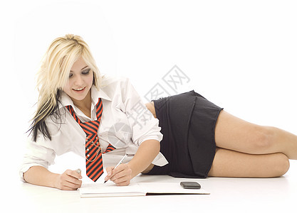 做家庭作业的漂亮少女白色女学生工作衬衫冒充女性女孩青年金发学生图片