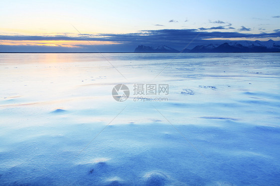 冰岛冷冻海岸假期蓝色海滩日落荒野天空地平线环境海岸线风景图片