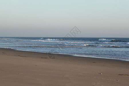 沙滩日落奥尔蒙海滩旅行热带海岸天气蓝色辉光地平线海浪阳光海洋图片