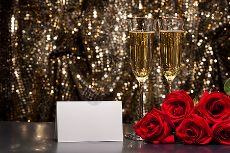香槟玫瑰花束香槟杯和玫瑰浪漫星星红玫瑰酒精魅力情人派对反射纪念日玻璃背景