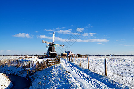 荷兰风车荷兰雪雪中的风车背景