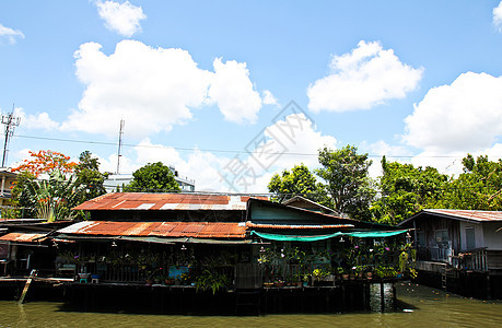 泰国运河沿线的木林房屋农村建筑旅行房子文化运输游客村庄商业热带图片