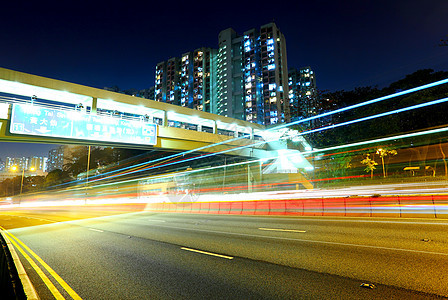 夜间的轻型交通小道城市运动景观戏剧性速度市中心建筑蓝色汽车公共汽车图片