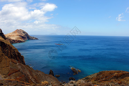 葡萄牙马德拉岛冲浪边缘地平线阳光波浪悬崖太阳海洋热带天空图片