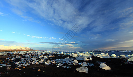 冰堡日落假期旅行海岸线冰川蓝色天空漂流海滩冰山风景图片