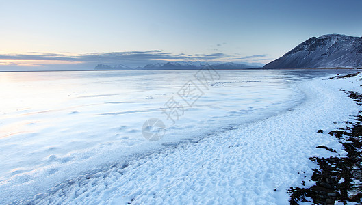 冰岛冷冻海岸旅行荒野蓝色海洋天空环境日落风景海滩地平线图片