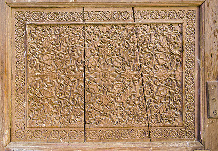 印度历史雕刻的木制门背景图片