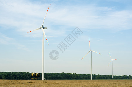 风风车全球金属发电机技术蓝色涡轮风车阳光绿色天空图片