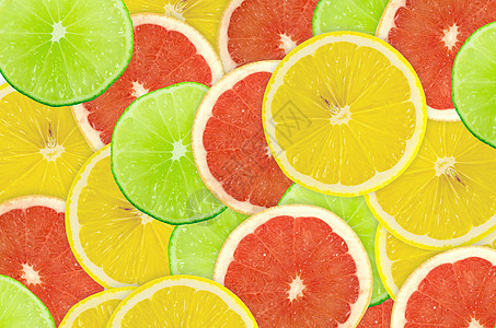柑橘切片摘要背景 特写 工作室照片圆圈摄影红色橙子框架宏观活力肉质绿色食物图片