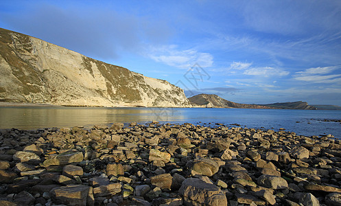 穆贝湾波浪涟漪太阳海洋英语潮汐岩石天空悬崖侏罗纪图片