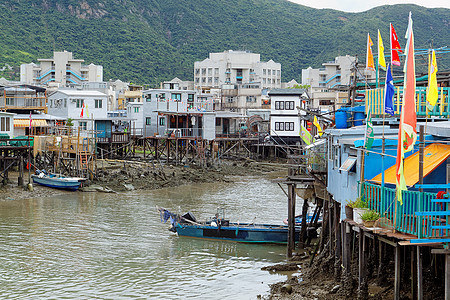 香港Tai O渔业村天空风化房子住宅村庄木头旅行建筑棚户区钓鱼图片