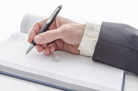 男性手工写作空白桌子笔记横截面裁剪经理白色成人圆珠笔软垫图片