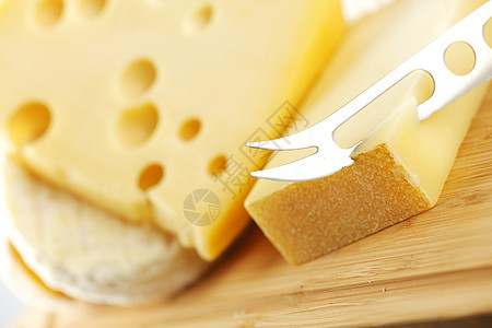 奶酪和奶酪刀气味木头生活奶制品食物香味午餐烹饪产品美食图片