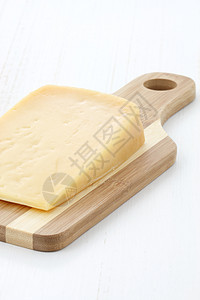 Gourmet 年老干酪奶酪黄色挑衅木头奶制品美食食物产品牛奶木板熟食图片