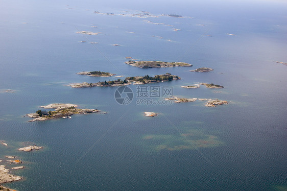 休伦湖水上飞机支撑飞机座舱天空岩石阳光照射海浪日落图片