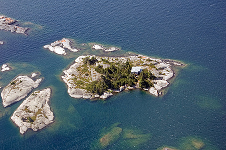 岛屿支撑水上飞机阳光照射海浪天空岩石飞机座舱日落图片