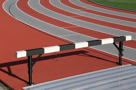 体育领域跨栏体育场成功车道比赛场地障碍竞赛竞争运动员背景图片