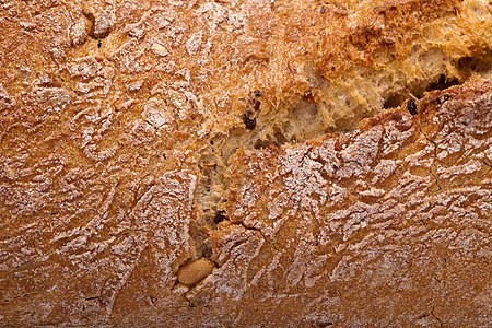传统烤熟面包的大型小面包植物宏观早餐面粉脆皮静物粮食玉米谷物麻布图片
