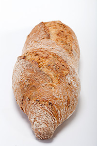 传统烤熟面包的大型小面包种子燕麦小麦乡村食物粮食面粉早餐宏观静物图片
