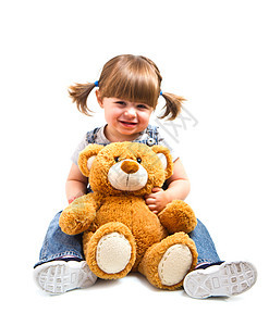 可爱的小孩女孩拥抱泰迪熊眼睛青年女性快乐乐趣童年幸福动物微笑婴儿图片