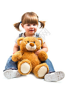 可爱的小孩女孩拥抱泰迪熊幸福儿童孩子眼睛童年白色青年乐趣动物女士图片