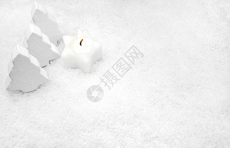 雪中白蜡烛背景图片