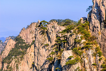 黄山和树晴天风景文化日落蓝色树木石头红色历史太阳图片