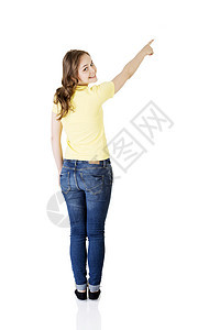 欢乐 兴奋的年轻女士指着复制空间情绪化广告黄色产品手指女孩快乐青少年成人手臂图片