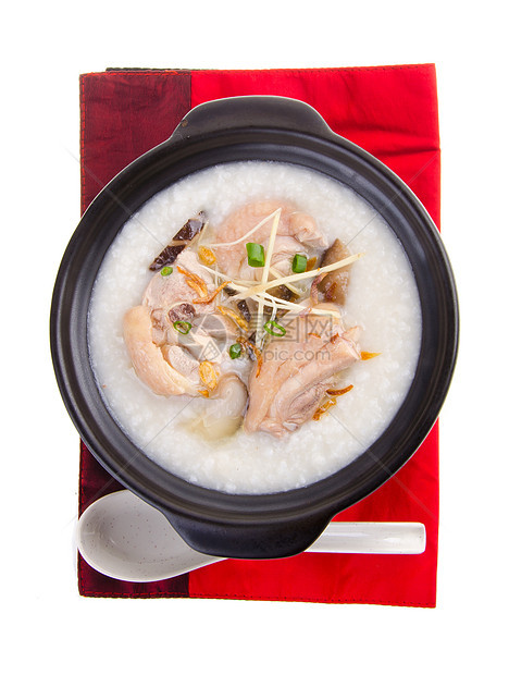 泥锅里用过传统的中国粥粥水稻汁稀饭猪肉蔬菜餐厅食物水平午餐早餐文化图片
